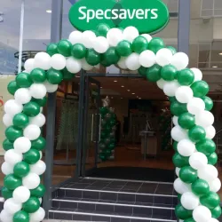 Green and white balloon arch