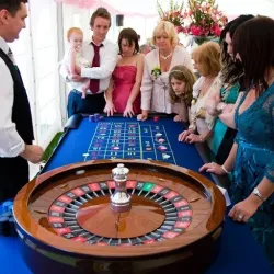 The roulette wheel and guests having fun!
